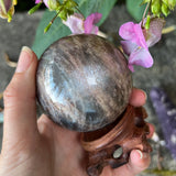 Black Moonstone & Sunstone Sphere with Wooden Stand